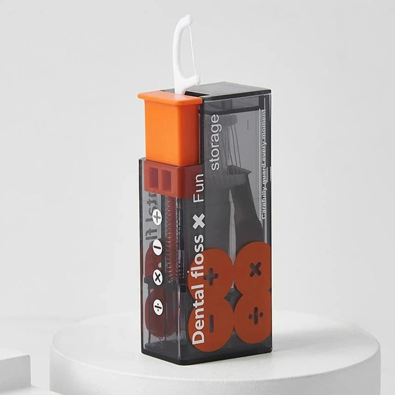 Orange portabel tandtrådsdispenser med tandtrådsbygel